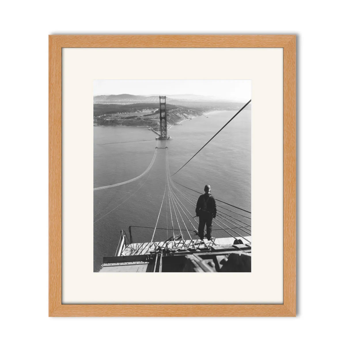 Man Standing on Cables of Golden Gate Bridge During Construction, 1935.