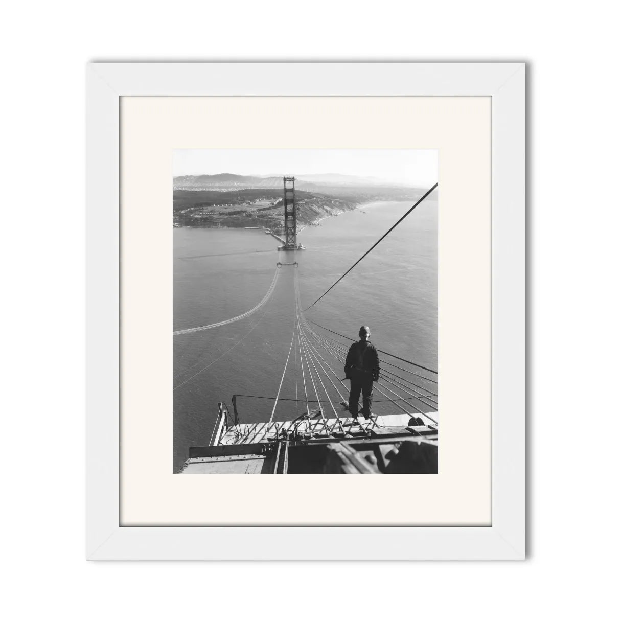 Man Standing on Cables of Golden Gate Bridge During Construction, 1935.