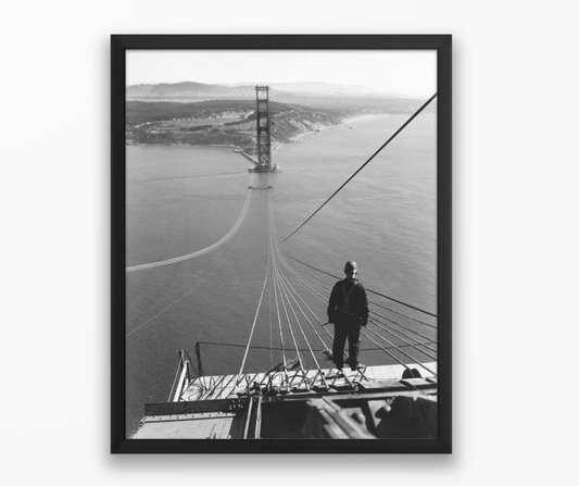 Man Standing on Cables of Golden Gate Bridge During Construction, 1935.