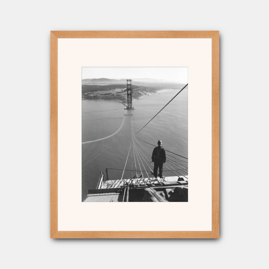 Man Standing on Cables of Golden Gate Bridge During Construction, 1935.