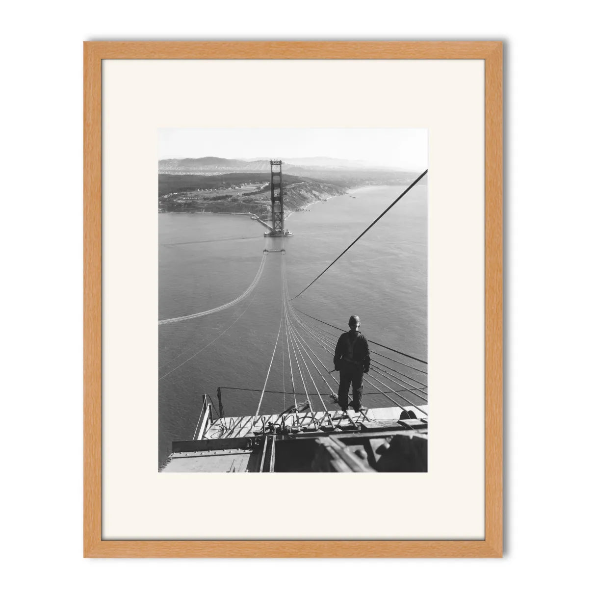 Man Standing on Cables of Golden Gate Bridge During Construction, 1935.
