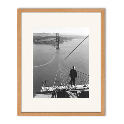 Man Standing on Cables of Golden Gate Bridge During Construction, 1935.