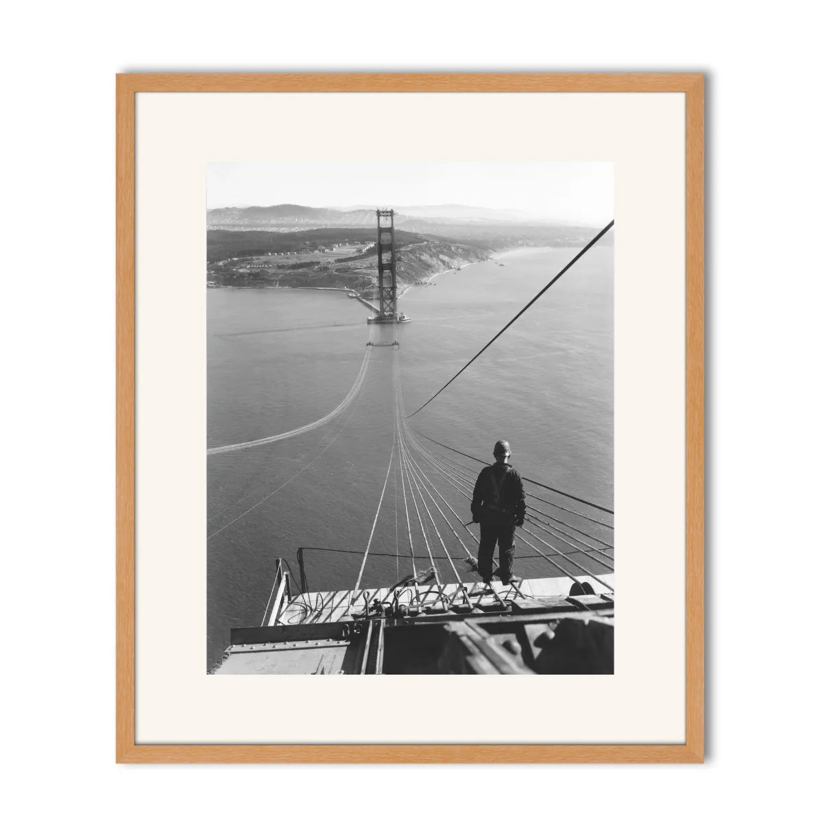 Man Standing on Cables of Golden Gate Bridge During Construction, 1935.