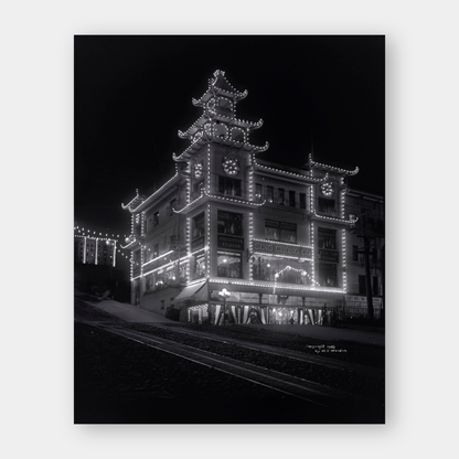 Chinatown building at California Street and Grant Avenue lit up at night, 1908