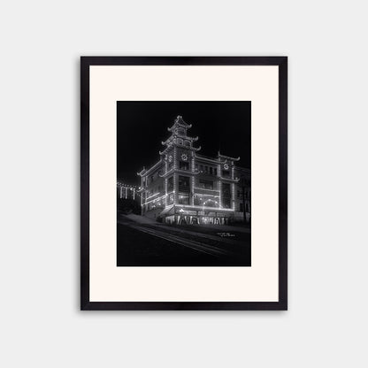Chinatown building at California Street and Grant Avenue lit up at night, 1908