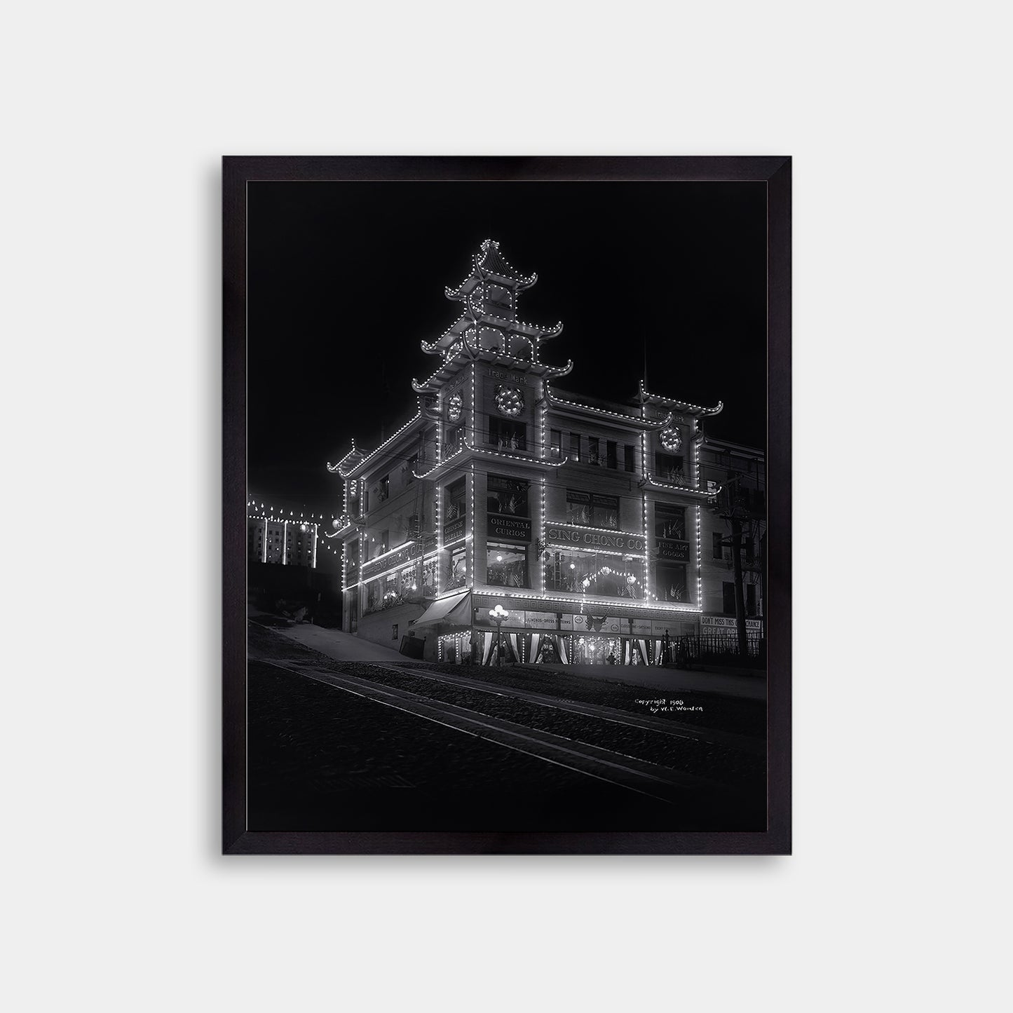 Chinatown building at California Street and Grant Avenue lit up at night, 1908