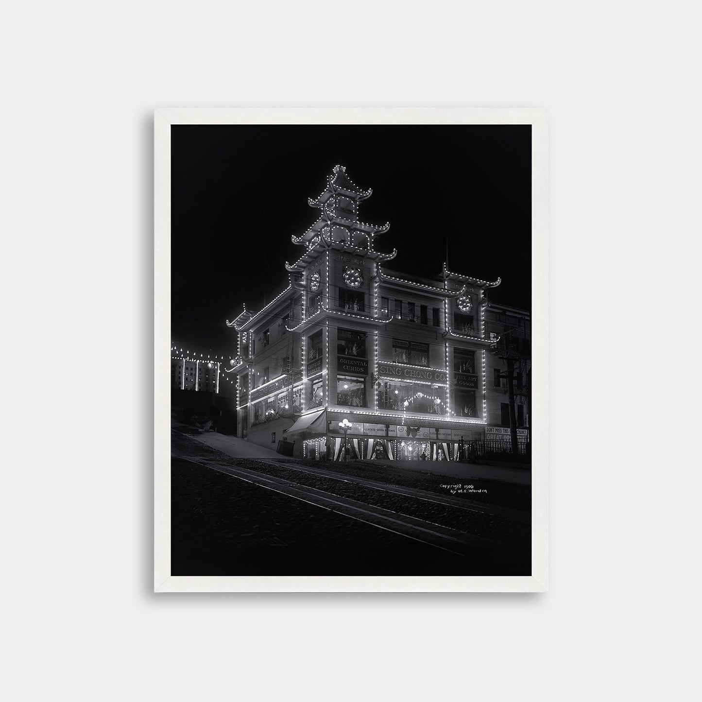 Chinatown building at California Street and Grant Avenue lit up at night, 1908