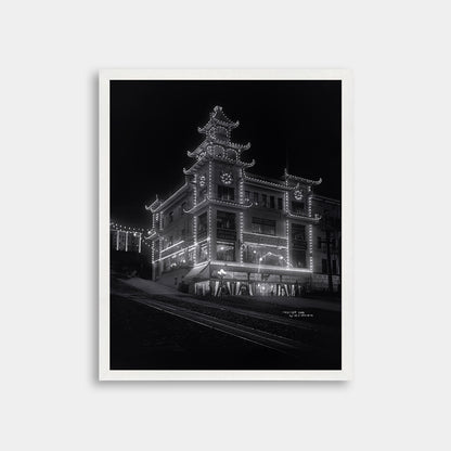 Chinatown building at California Street and Grant Avenue lit up at night, 1908