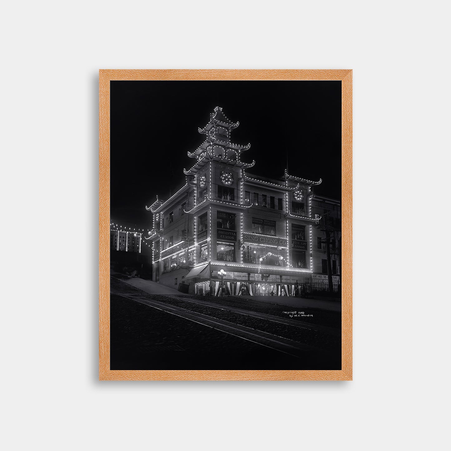 Chinatown building at California Street and Grant Avenue lit up at night, 1908