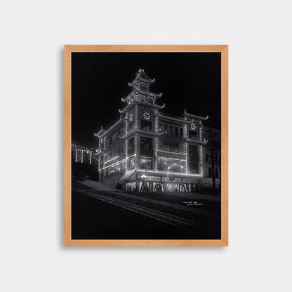 Chinatown building at California Street and Grant Avenue lit up at night, 1908