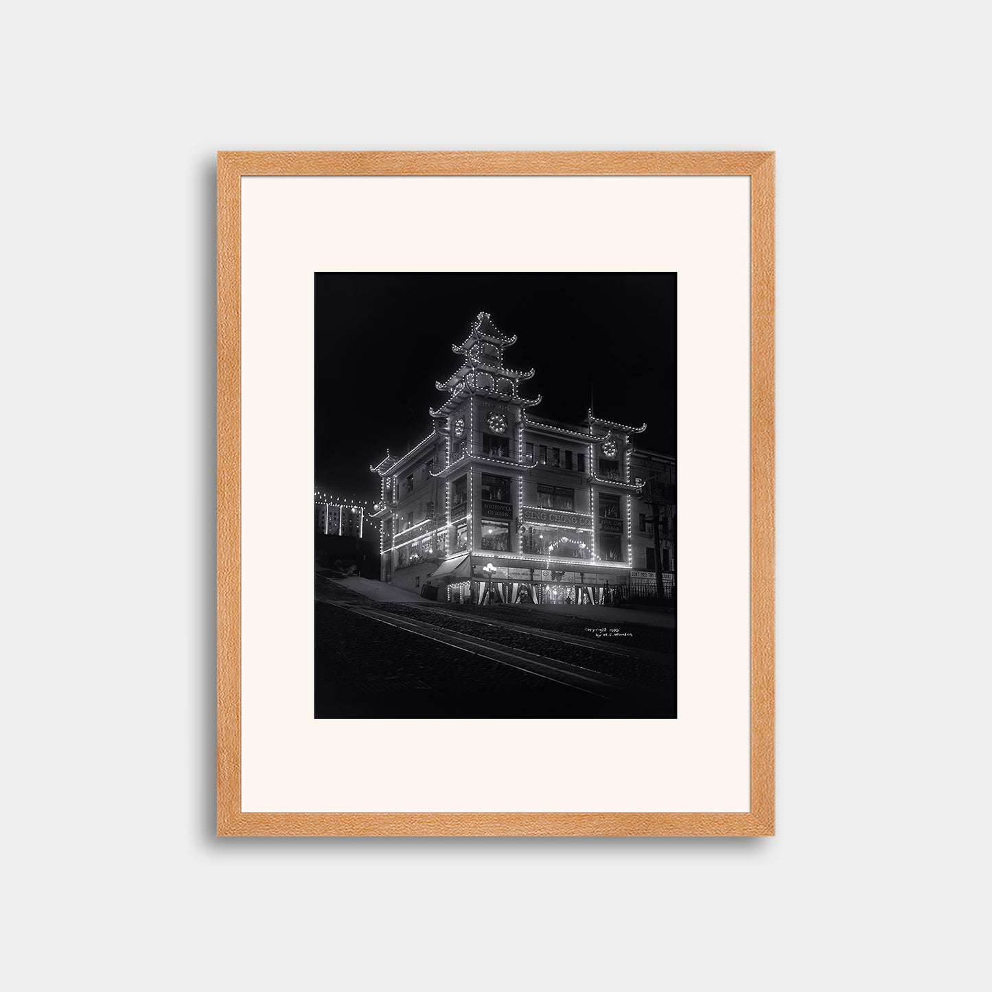 Chinatown building at California Street and Grant Avenue lit up at night, 1908