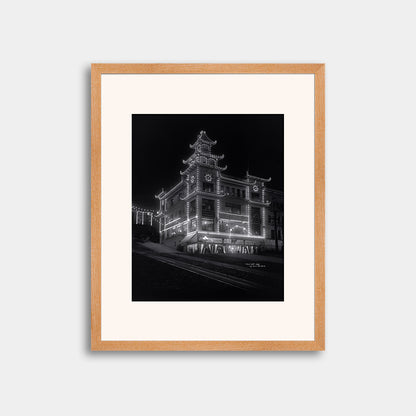 Chinatown building at California Street and Grant Avenue lit up at night, 1908