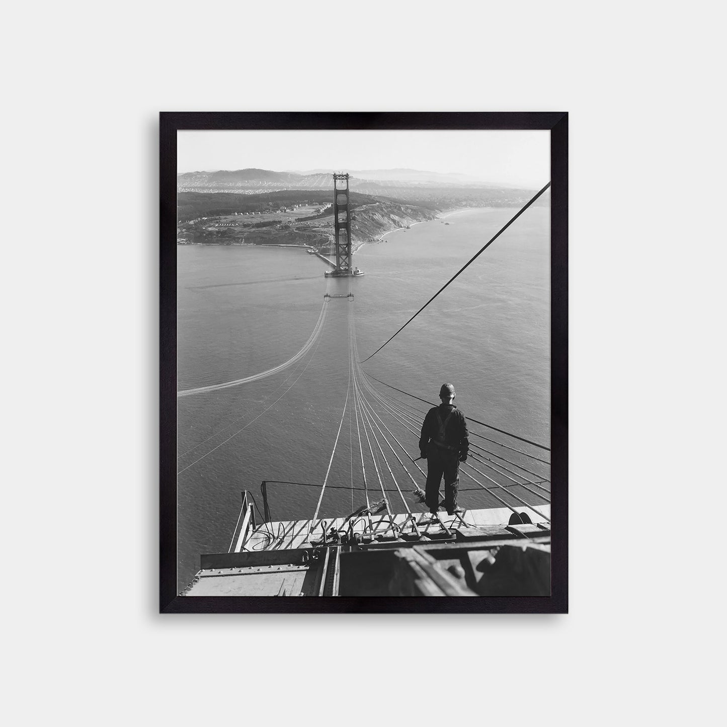 Man Standing on Cables of Golden Gate Bridge During Construction, 1935.