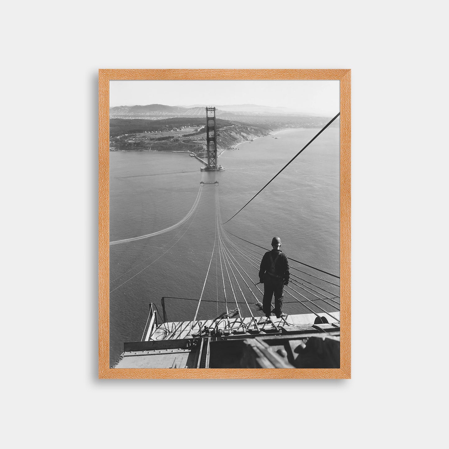 Man Standing on Cables of Golden Gate Bridge During Construction, 1935.
