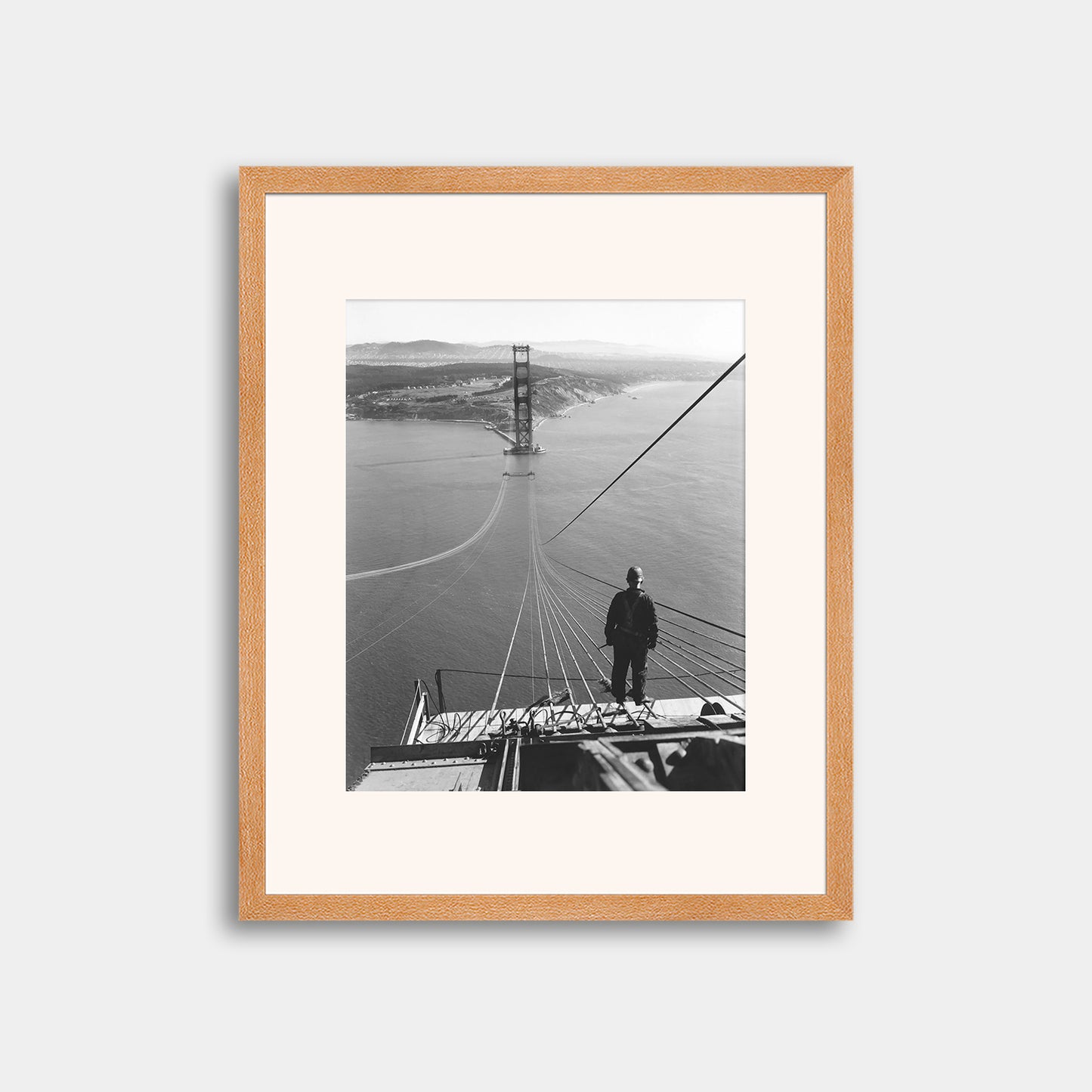 Man Standing on Cables of Golden Gate Bridge During Construction, 1935.