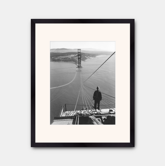 Man Standing on Cables of Golden Gate Bridge During Construction, 1935.