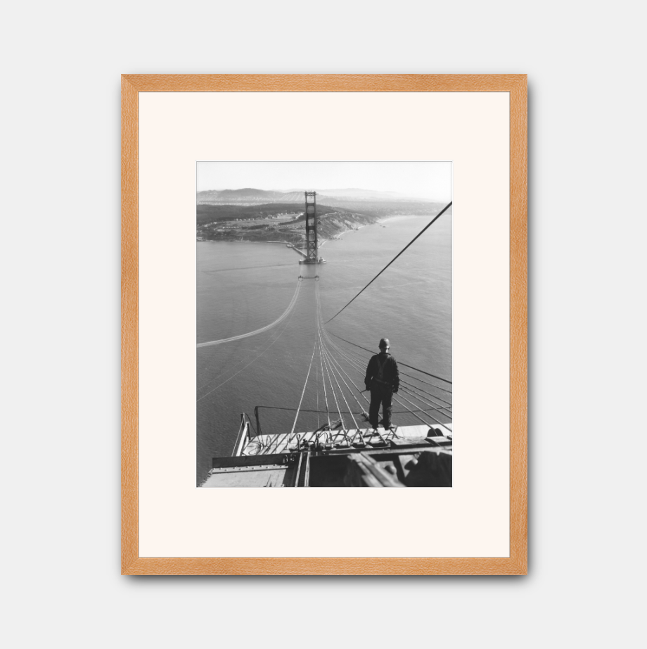 Man Standing on Cables of Golden Gate Bridge During Construction, 1935.