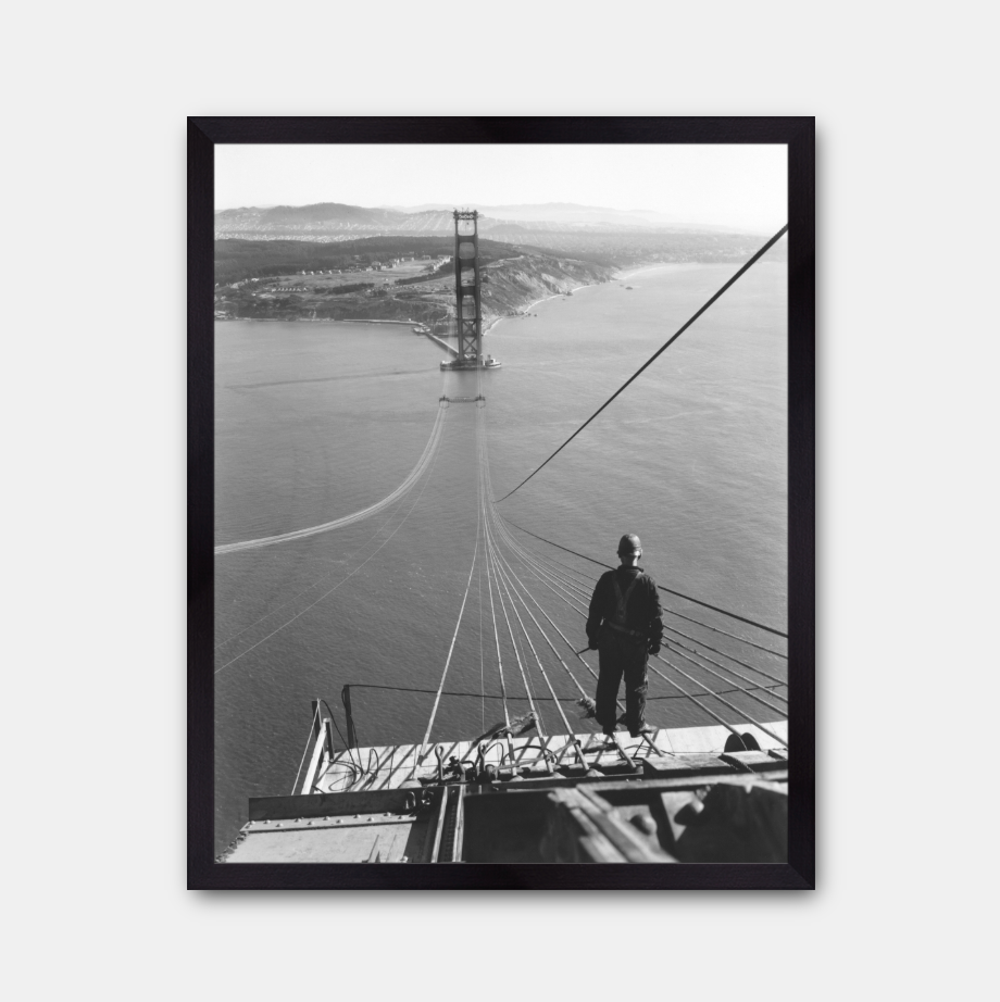 Man Standing on Cables of Golden Gate Bridge During Construction, 1935.